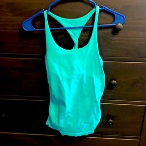 Bebe M/L workout top. Light built in bra. Runs small. Light wear.